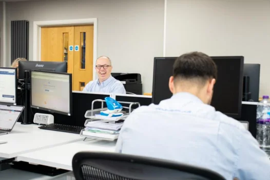 two men at desks